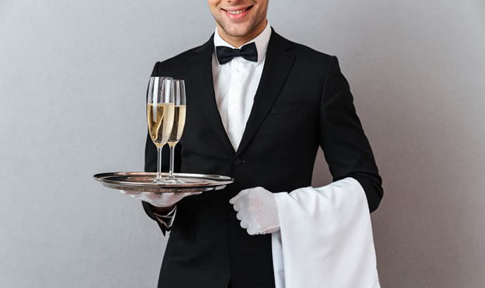 Hospitality Consulting cropped image waiter holding glasses champagne towel