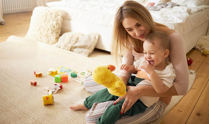 Hospitality Consulting a women holding a child in her hands